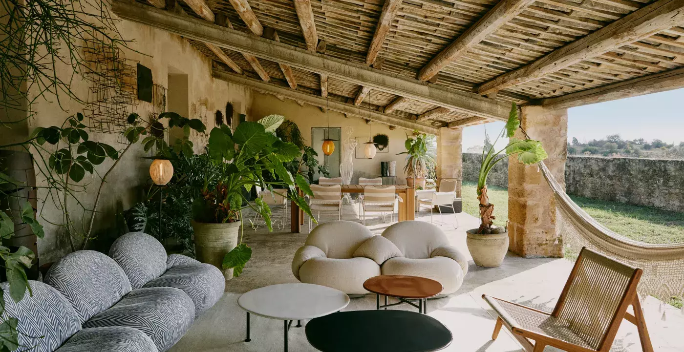 Artistic furniture arrangement under gallery-style lighting